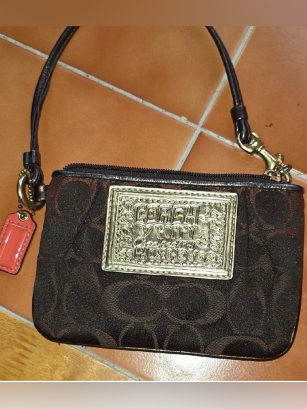 Coach Brown Poppy Signature
Wristlet with Gold Plaque w/ Original Hang Tag GUC - Picture 2 of 14